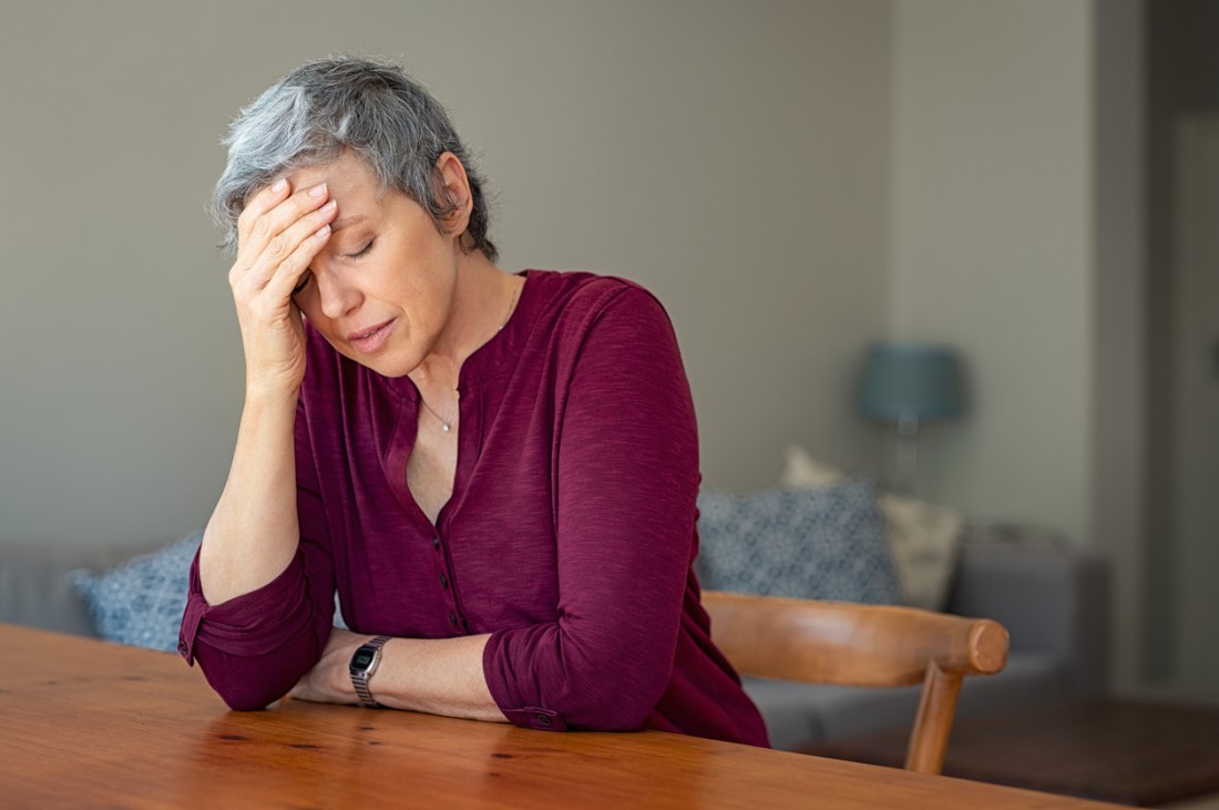A family caregiver experiencing burnout at home